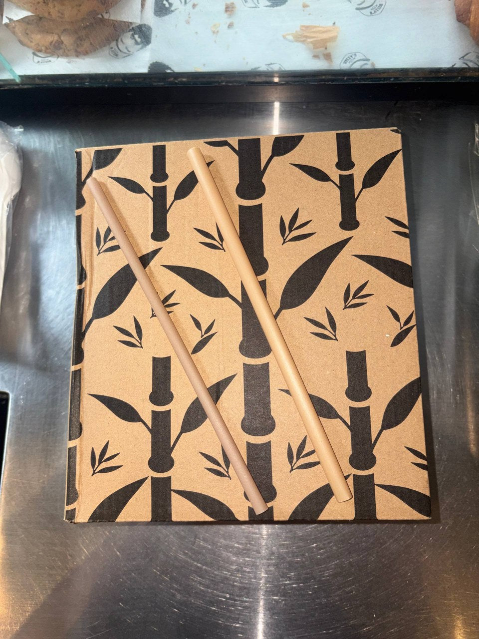 Our two straw sizes photographed together on a kraft box at Billy’s café